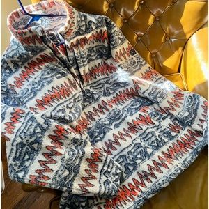 Warm, funky pullover. Elastic drawstring, hidden zipper pocket. Never worn.